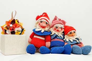 Three small crocheted elves on white background 