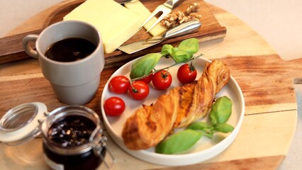 Golden flaky bread with creamy cheese slices, basil, tomatoes on wooden board, cheese, jam , portraying artisan pairing in rustic elegance. Focused on classic flavors, inviting presentation.