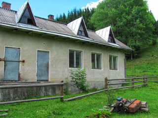 A derelict building of a former collective farm in the countryside