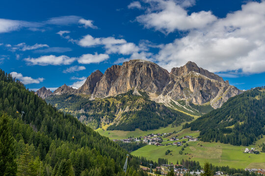 Dolomites sunny weather in summer mountains. Green valley and beautiful mountain rocky peaks in the Alps. Alpine scenic landscape in South Tyrol region in Italy