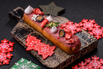 Sweet eclair with chocolate filling, decorated for Christmas