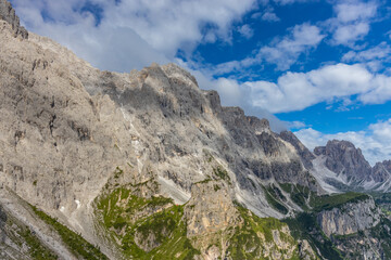 Dolomites sunny weather in summer mountains. Green valley and beautiful mountain rocky peaks in the Alps. Alpine scenic landscape in South Tyrol region in Italy