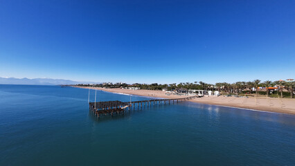 Obraz premium Antalya beaches, Mediterranean beaches, Antalya's turquoise sea, beach, pier