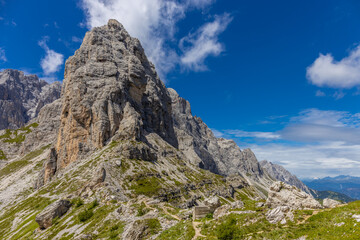 Dolomites sunny weather in summer mountains. Green valley and beautiful mountain rocky peaks in the Alps. Alpine scenic landscape in South Tyrol region in Italy