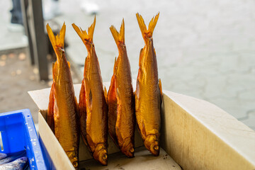 Fresh fish sold by street vendors in boxes.