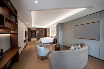Modern hotel room with a bright and airy feel, a luxury hotel room. Example of a hotel room, modern furnishings and architecture.