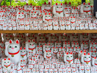 Gotokuji Temple: Tokyo's Birthplace of Maneki Neko 'Lucky Cat' Shinto Shrine for good fortune and Cat Lovers. Porcelain figure and temple details