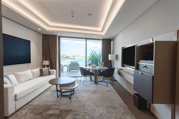 Modern hotel room with a bright and airy feel, a luxury hotel room. Example of a hotel room, modern furnishings and architecture.