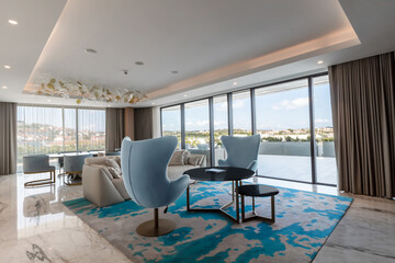 Modern hotel room with a bright and airy feel, a luxury hotel room. Example of a hotel room, modern furnishings and architecture.