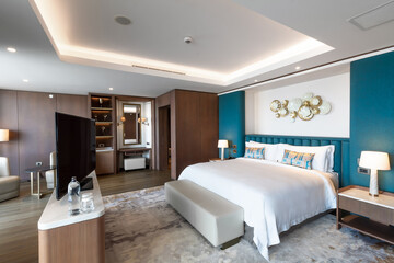 Modern hotel room with a bright and airy feel, a luxury hotel room. Example of a hotel room, modern furnishings and architecture.