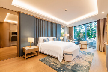 Modern hotel room with a bright and airy feel, a luxury hotel room. Example of a hotel room, modern furnishings and architecture.