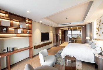 Modern hotel room with a bright and airy feel, a luxury hotel room. Example of a hotel room, modern furnishings and architecture.