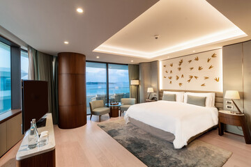 Modern hotel room with a bright and airy feel, a luxury hotel room. Example of a hotel room, modern furnishings and architecture.