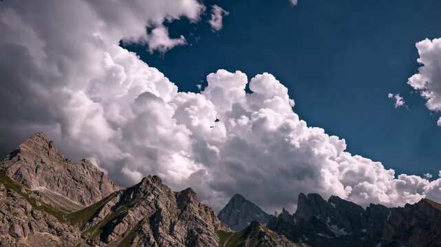 Dramatic Mountain Range with Towering Cumulus Clouds. Cloud Dancer - Color of the year 2026