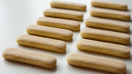 Savoiardi Biscuits Lined Up on White Background