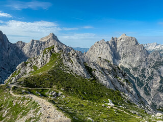 Hiking trail to Gamsova Spica with scenic view of rugged mountain peak Razor and Prisank, wild...