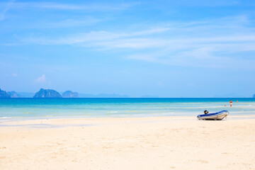 Seascape. Travel and tourism. Sea coast with islands of Krabi province in Thailand, motor boat on the shore