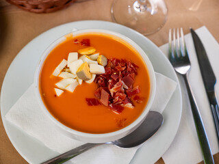 Cordoban salmorejo with ham and egg shavings is a traditional Spanish cold tomato soup.
