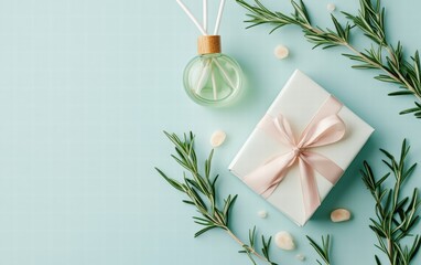 A luxurious spa gift certificate tied with a silk ribbon placed near a diffuser and sprigs of rosemary on a light blue background