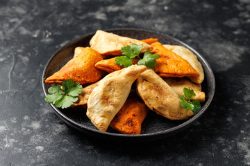 Freshly served traditional empanadas in a plate. Mexican food