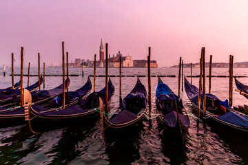 Venice, Italy - February 4, 2024: San Giorgio Maggiore Island and Traditional Gondolas in Venice,...