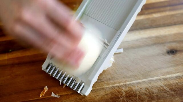 Precision Slicing: Chef Using Mandoline on Fennel Bulbs in 4K