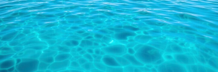 Obraz premium Ripples expanding across a pristine, reflective body of water, aqua, underwater