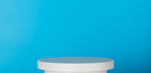 Abstract background template for product display and presentation. Oval podium or pedestal against blue background.