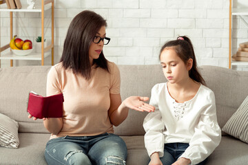 Family financial problems during coronavirus pandemic. Unhappy mother and her daughter with empty...