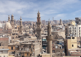 A panoramic view of Cairo's historic Islamic city, showcasing a dense and intricate urban landscape.