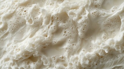 Close-up of creamy, textured, frothy substance.