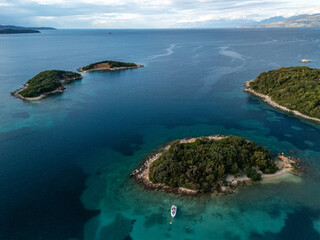 An aerial view of Ksamil Islands surrounded by blue and turquoise waters. Albania
