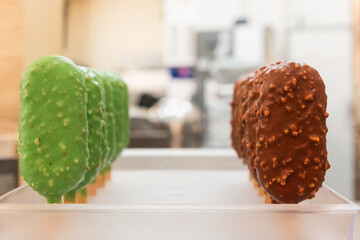 Colorful gelato bars lined up in an Italian bakery