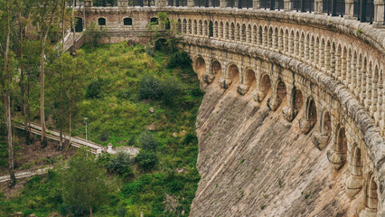 A Historic Aqueduct, a magnificent structure, beautifully surrounded by lush greenery and nature