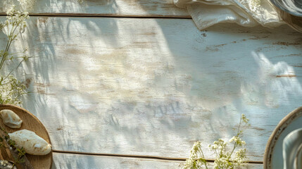 Fototapeta premium Sunlit rustic wooden table with flowers and plates.