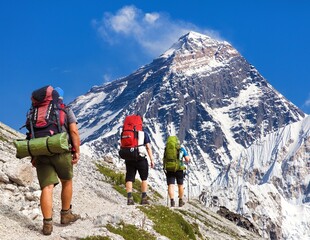Mount Everest as seen from gokyo valley and three hikers