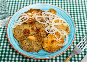 Salad bowl with pickled brittlegills (Russula delica) and thin sliced white onions. Delicious homemade pickles