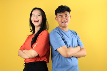 Portrait of Cheerful Young Couple Smiling with Crossing Arm, Standing Together