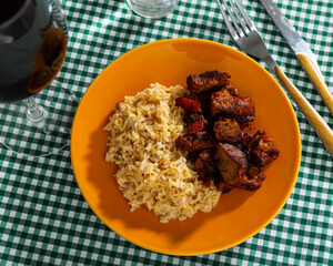 Delicious dish of fried beef slices with rice