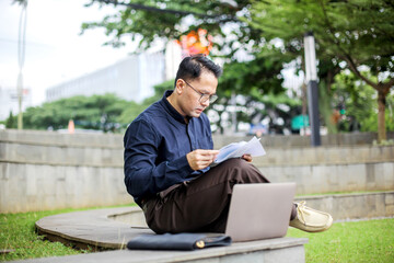 Fototapeta premium Portrait of Busy Man In Formal Style Reading Data Analyst While Working Using Laptop