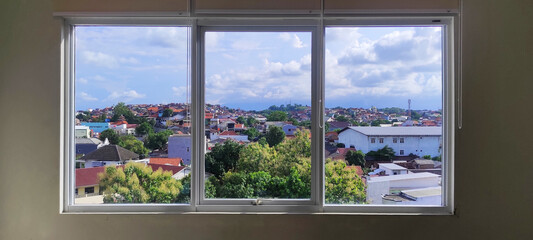 large window, divided into three parts by window frame, beautiful view, residential area,...