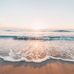 Fototapeta premium A serene beach scene at sunset, featuring gentle waves lapping against the sandy shore under a pastel sky.
