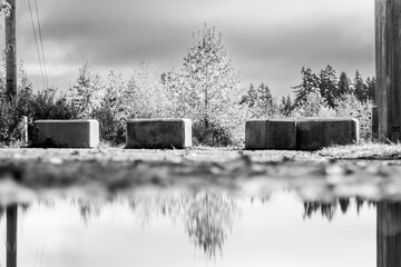 landscape with concrete block fence, black and white