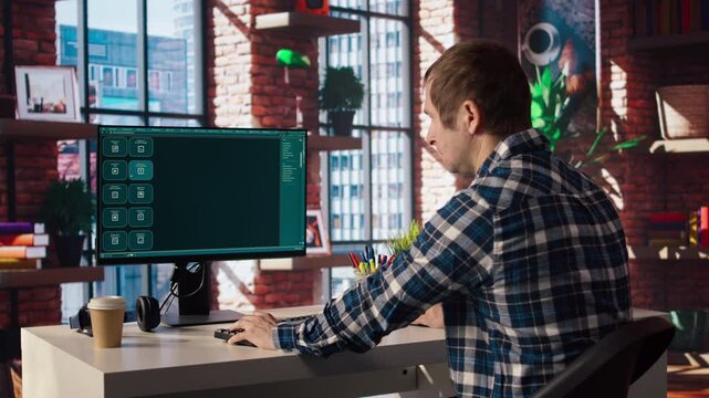 Man having fun interacting with AI LLM chatbot PC GPT software on PC in modern home office. User using large language model application communicating through artificial intelligence, camera A
