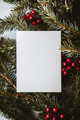 Fototapeta premium White Paper Mockup for Invitation or Greeting Card on Christmas Background with Festive Decor