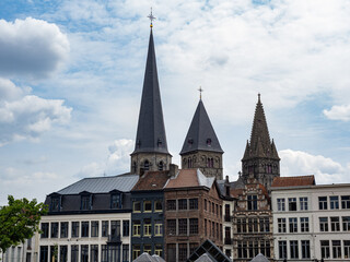 Photograph of a street in Gouda with the towers in the background. Netherlands