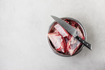 Raw beef ribs in bowl