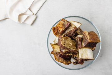 Beef ribs in glass bowl