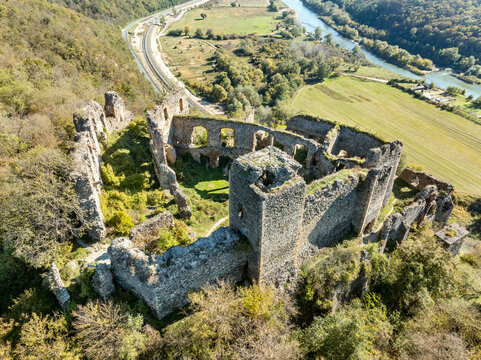 Aerial view of Soimos medieval castle in Romania near Lipova above the Mures river with Gothic details