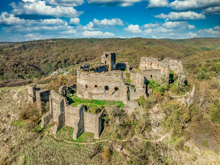 Fototapeta premium Aerial view of medieval Solymos, Soimos castle ruin in Romania above the Mures river, square keep, gate house, concentric walls near Lipova